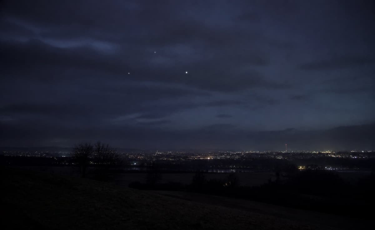 Muted night sky with soft points of light